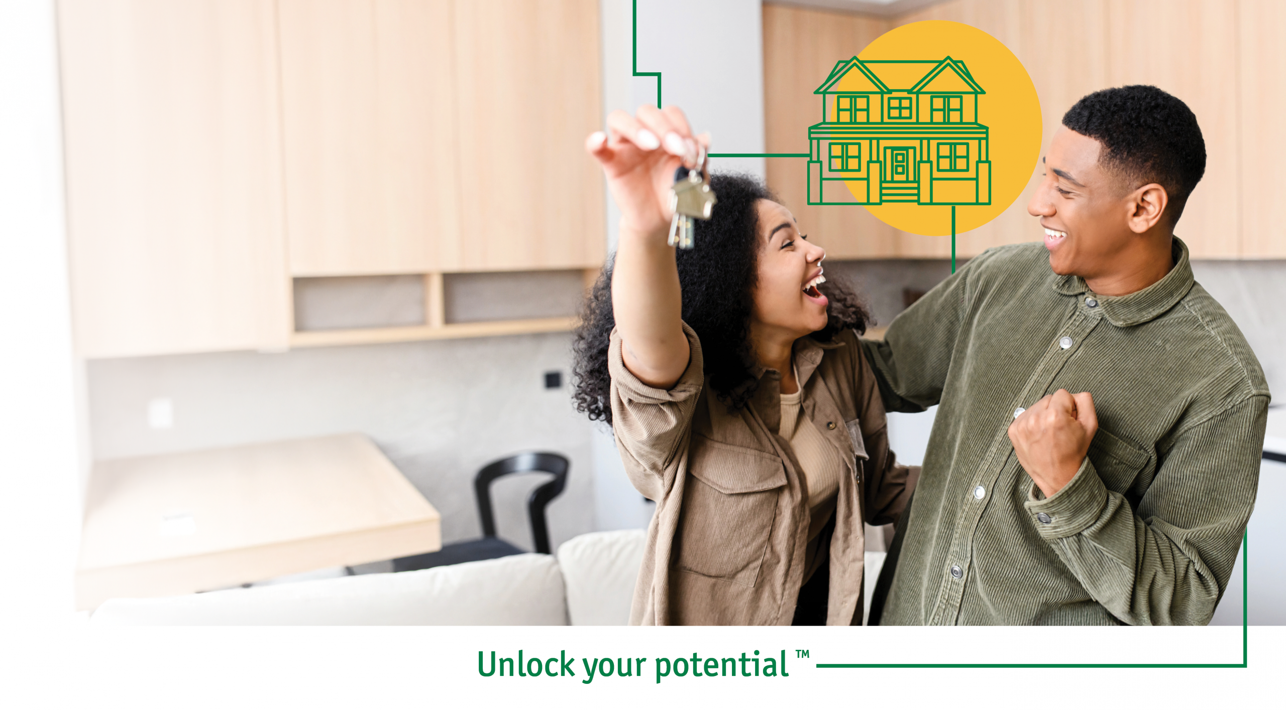 A couple holding keys standing in the kitchen of their new home.