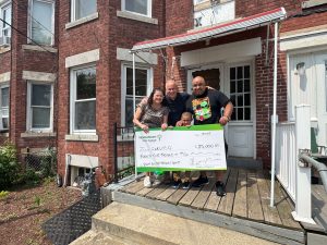 Grant recipient, Carlos with Hometown Mortgage lender.