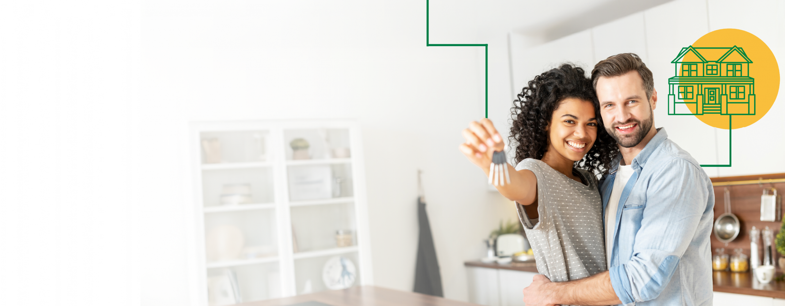 A woman and man holding up a house key in their new home.