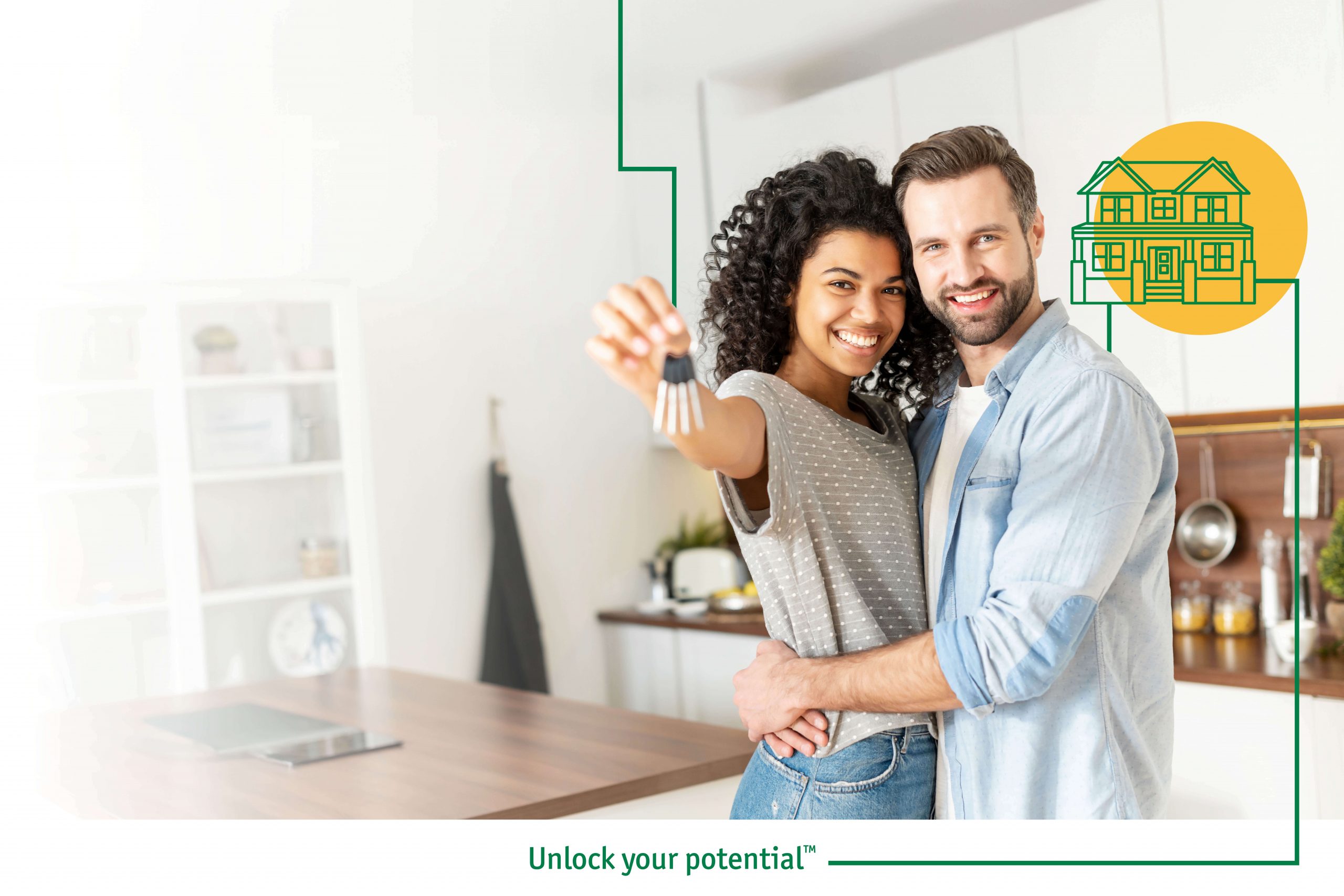 A woman and man holding up a house key in their new home.